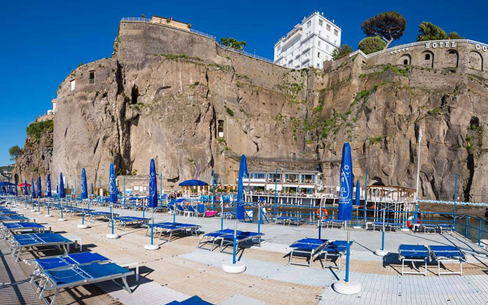 La Marinella beach is located under an imposing rock